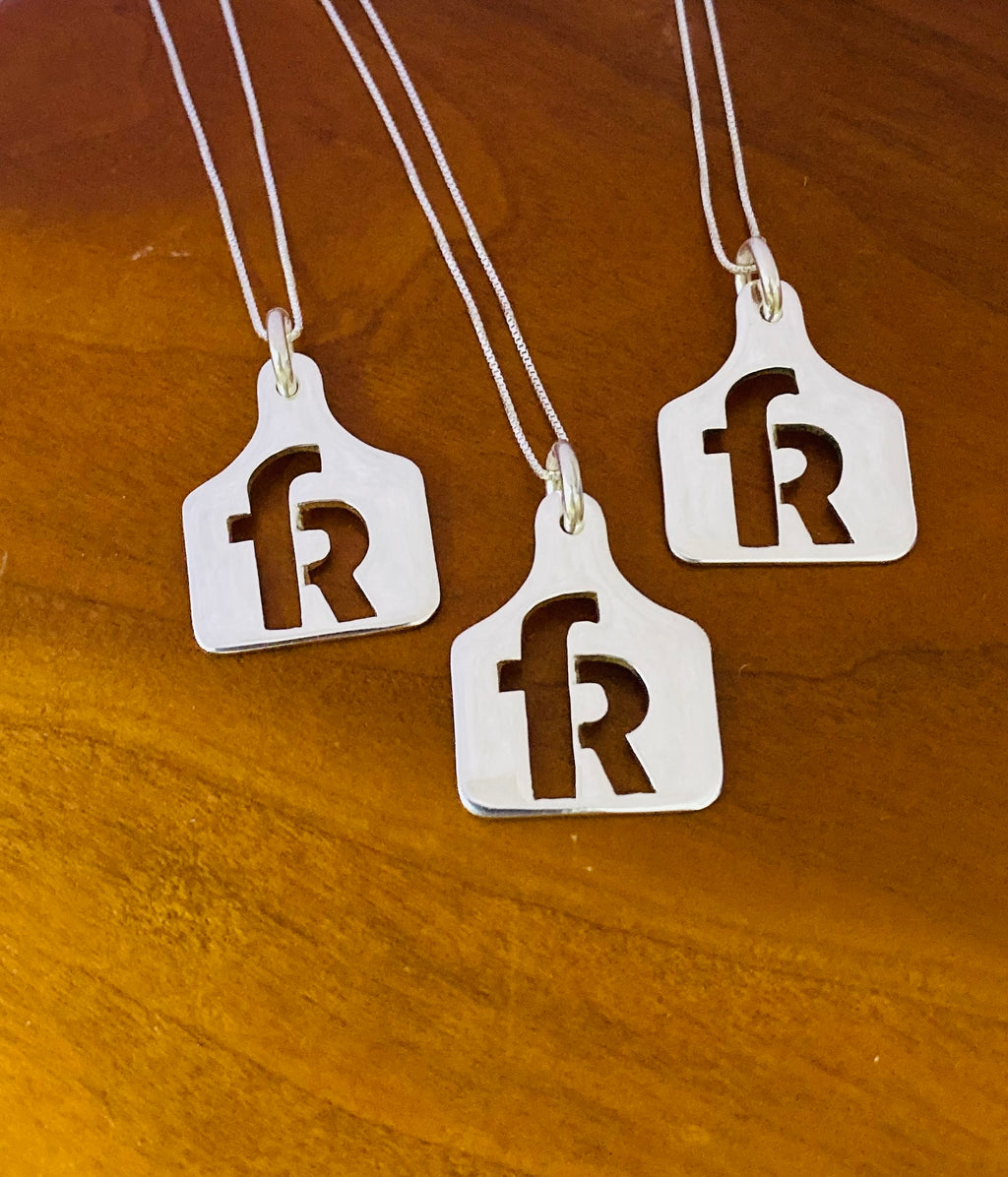 Three sterling silver ear tag necklaces with a matching R ranch brand for a family