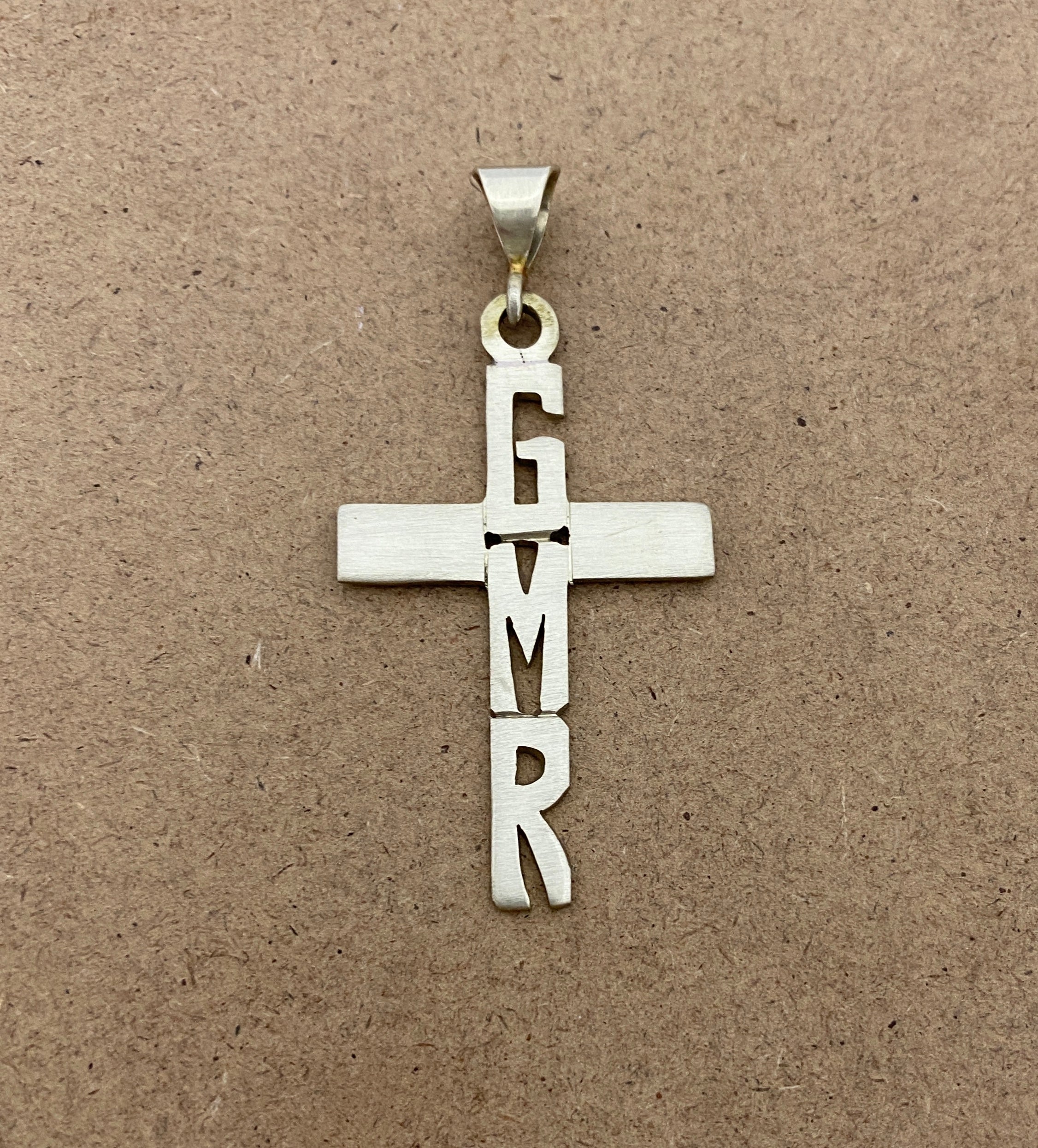 Hand Cut Letters on Cross Necklace