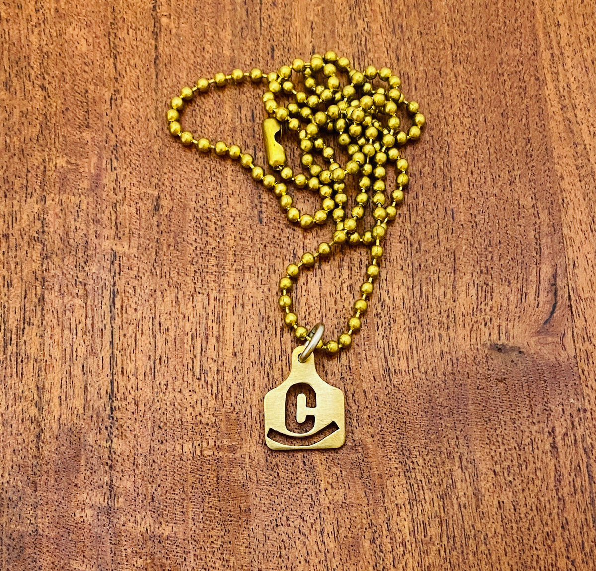 Ear Tag Pendant- HAND CUT - we hand cut Ranch or Cattle Brands in Brass, Nickel or Copper