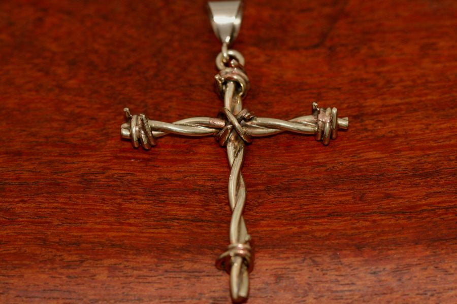 Barbed wire cross pendant in brass