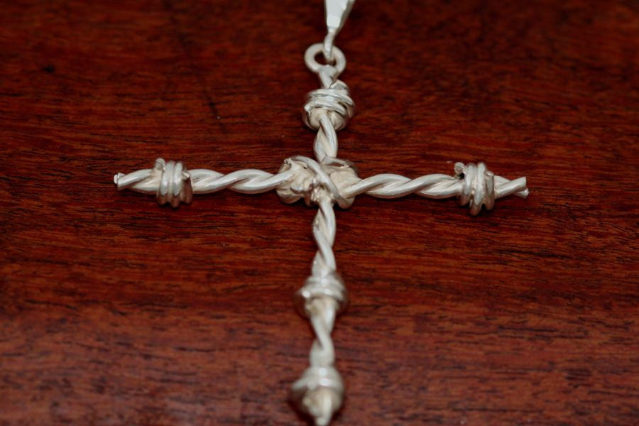 Barbed wire cross pendant in sterling silver