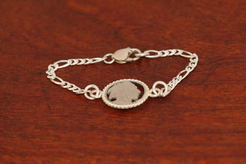 Handcut Indian Coin, with Sterling Silver Rope Trim on a Silver Bracelet