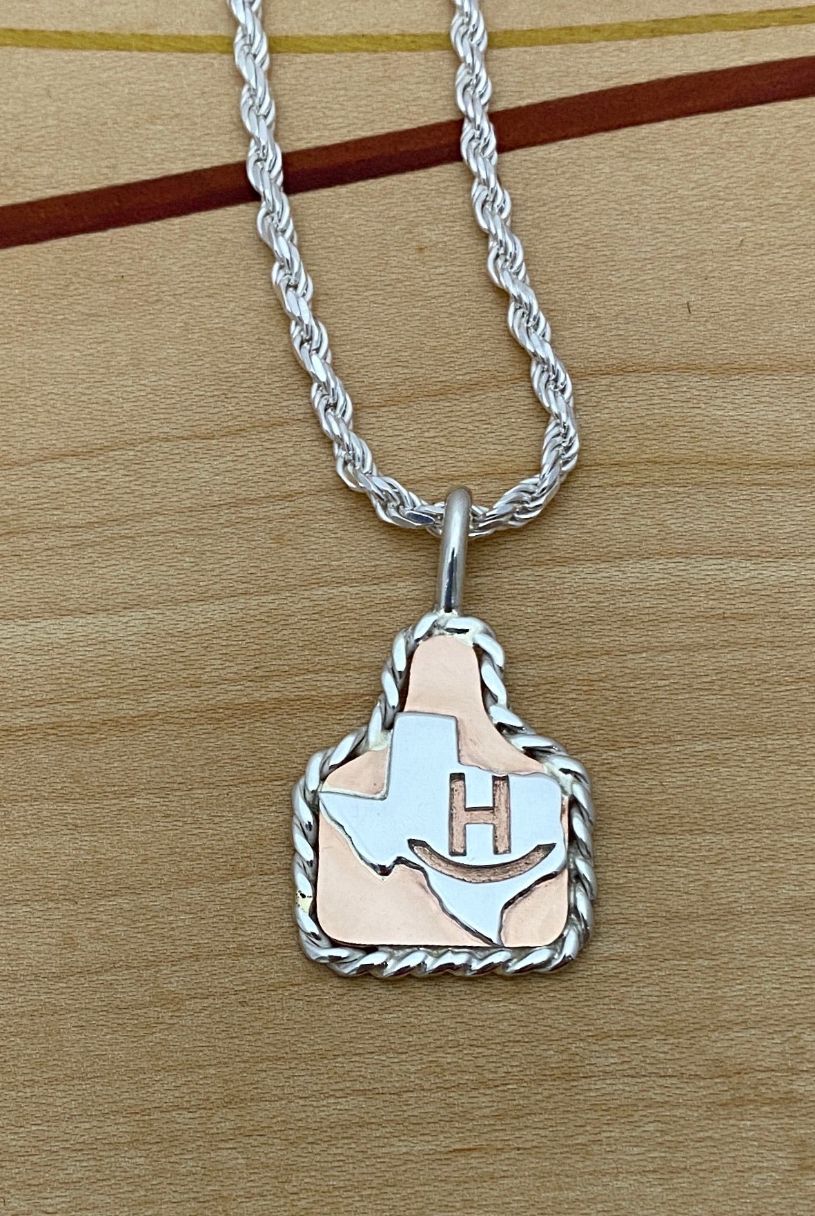 Ear Tags in Copper with Brand in Texas and Sterling Rope Trim