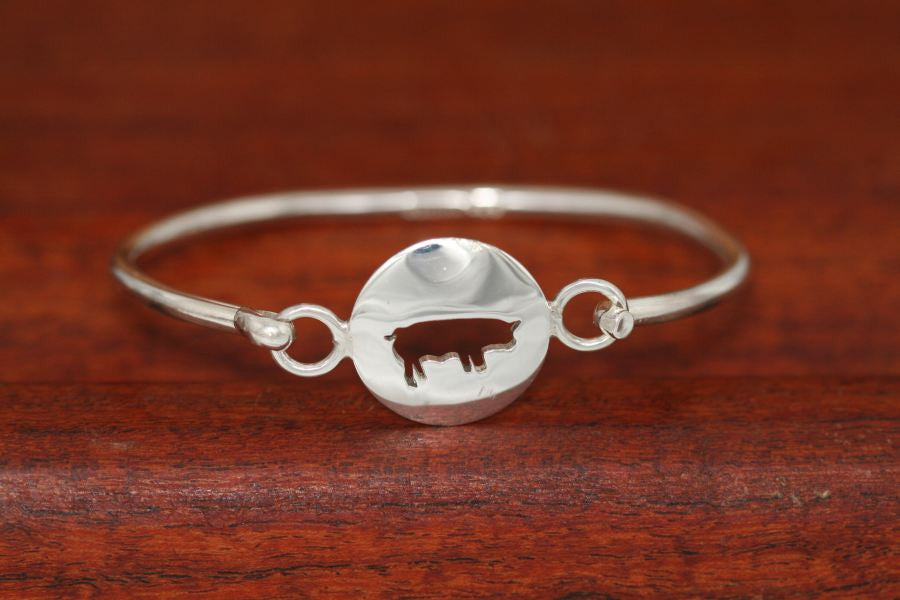 Small Swine Disc-Charm on a Bangle Bracelet